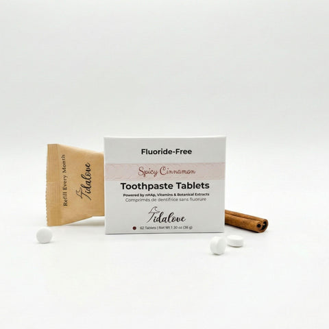 Fluoride-Free Spicy Cinnamon Toothpaste Tablets packaging with tablets and a cinnamon stick on a white background