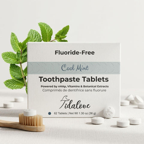 Box of Tidalove fluoride-free toothpaste tablets with mint leaves and tablets on a light background
