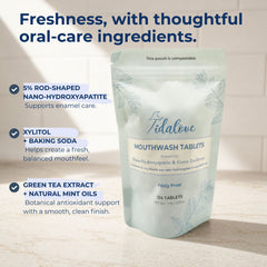 A stand-up pouch of Tidalove Mouthwash Tablets on a light stone surface with marketing text callouts on the left. The pouch is pale mint green with white and blue-gray text and leaf illustrations.
