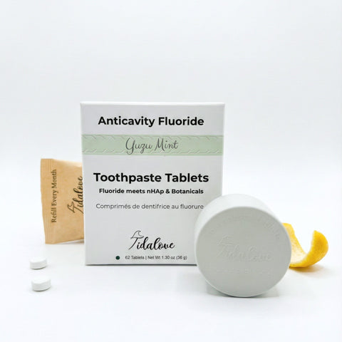 Tidalove toothpaste tablets packaging with tablets and a container on a white background
